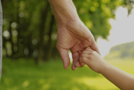 parent holding childs hand